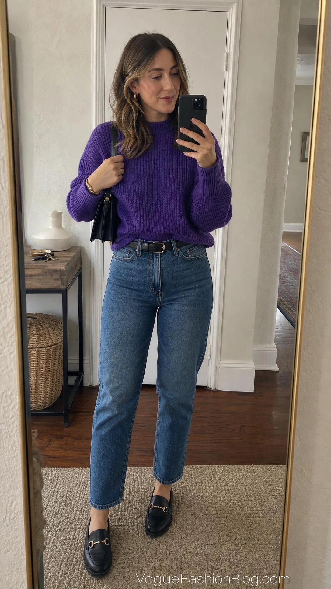 Mirror selfie of a woman in a ribbed sweater, straight-leg jeans, loafers, and black bag for Royal Purple Outfit Ideas for Fall 2026