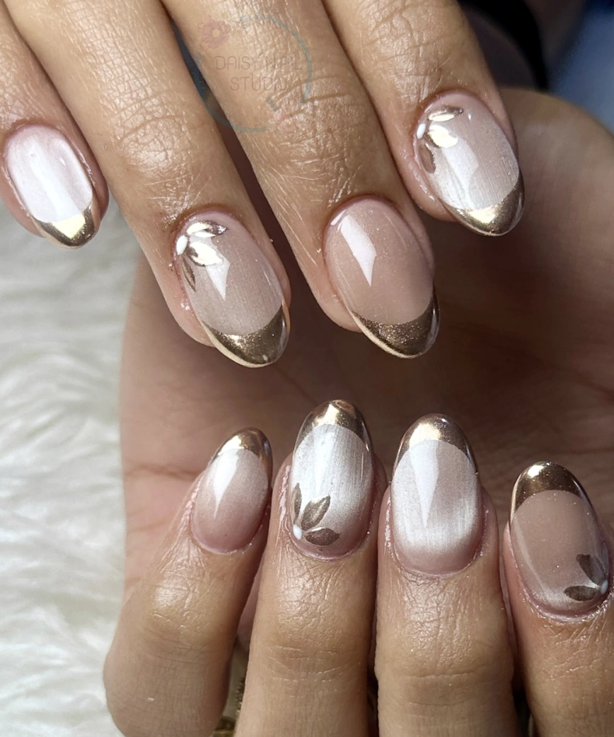 Almond Nails with Golden French Tips and Floral Accents