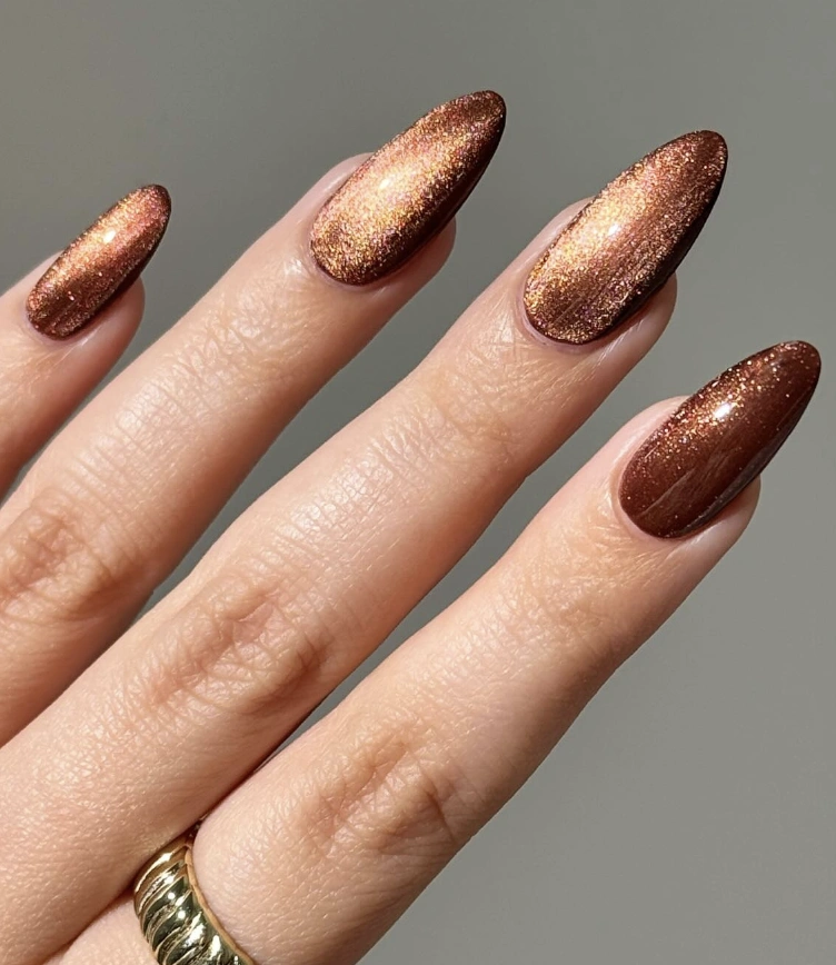 Almond-Shaped Mocha Brown Nails with Shimmer Effect