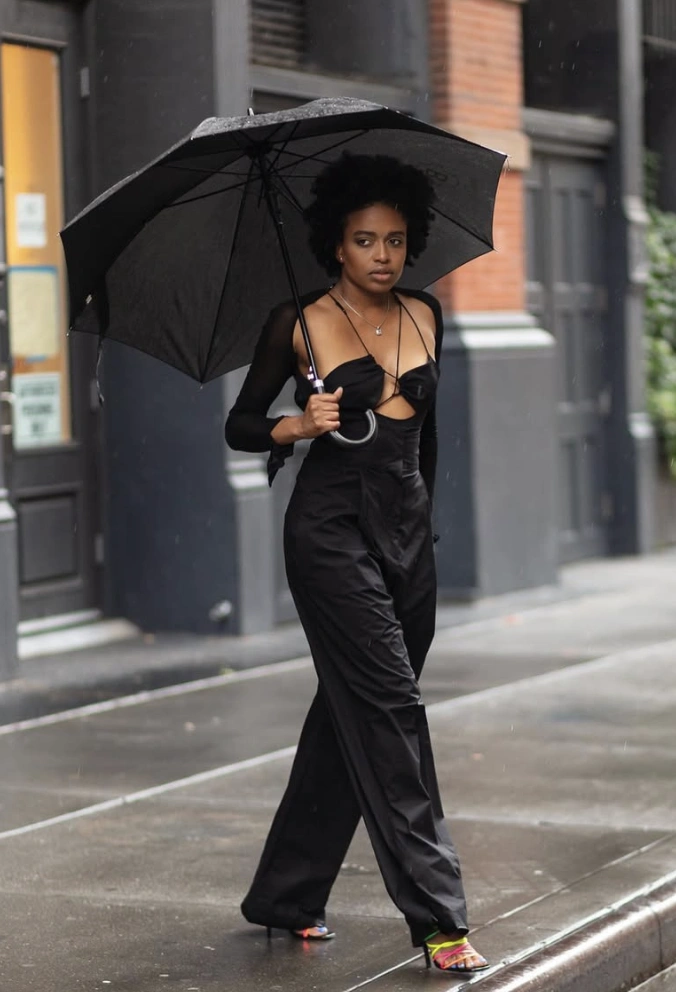 Black Cutout Jumpsuit + Sheer Shrug + Colorful Heels + Umbrella
