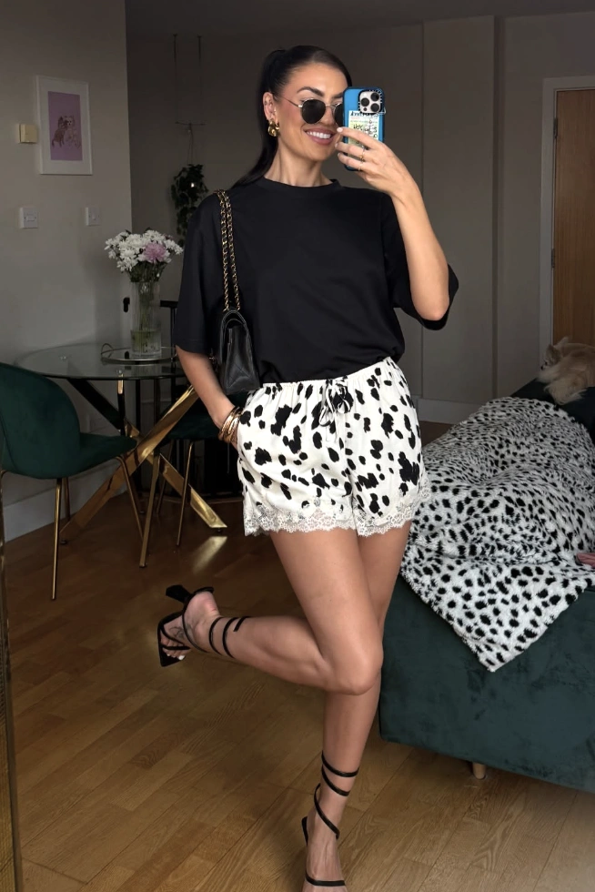 Black Oversized T-Shirt + Polka Dot Lace Trim Shorts + Strappy High Heels