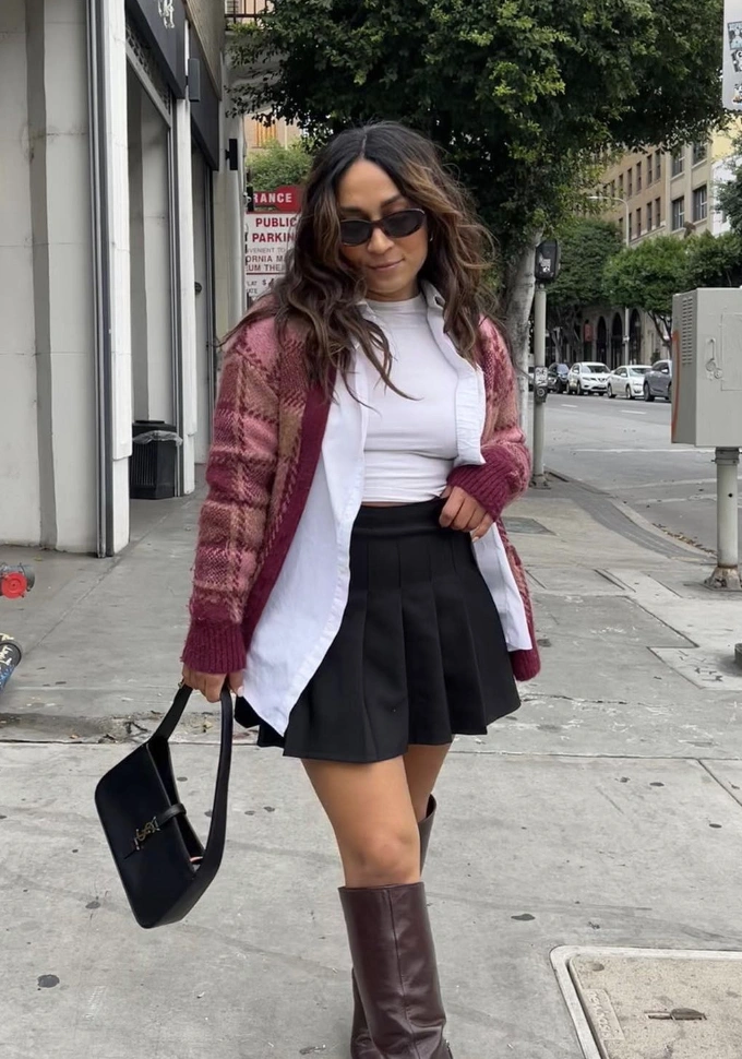 Black Pleated Skirt + White Mock Neck Top + Maroon Cardigan + Brown Knee-High Boots