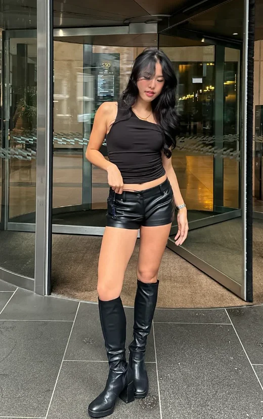 Black Sleeveless Tank Top + Black Leather Shorts + Black Knee-High Boots