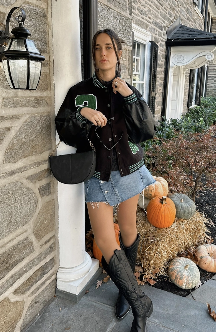 Black Varsity Jacket + Light Blue Denim Mini Skirt + Black Knee-High Cowboy Boots