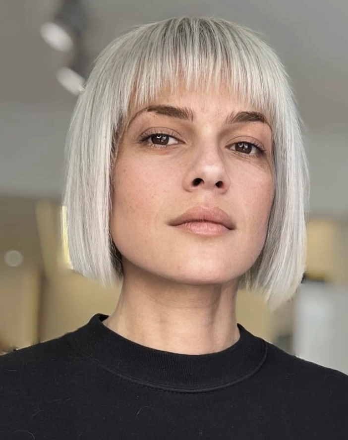 Blunt Silver Bob Hairstyle with Straight Bangs