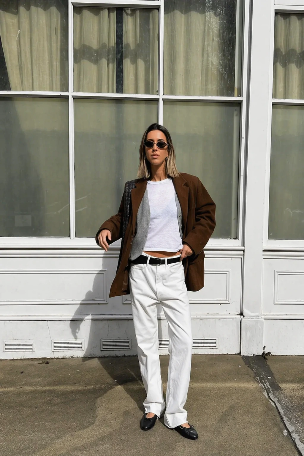 Brown Oversized Blazer + White Cropped T-Shirt + White Straight-Leg Jeans + Black Belt + Black Pointed-Toe Flats