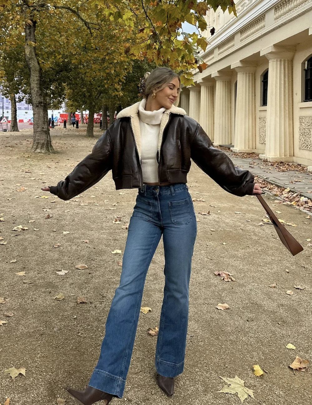 Brown Shearling Jacket + Cream Turtleneck + Wide-Leg Jeans