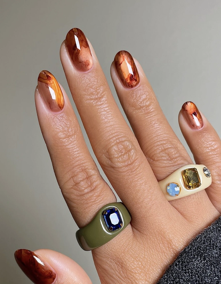Caramel Swirl Oval Nails with Abstract Detailing