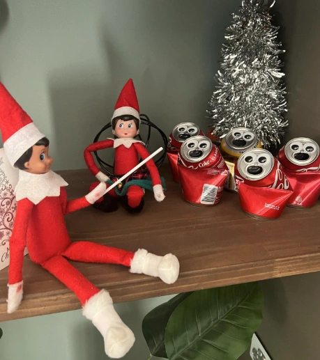 Charming Red and White Elves with Playful Props