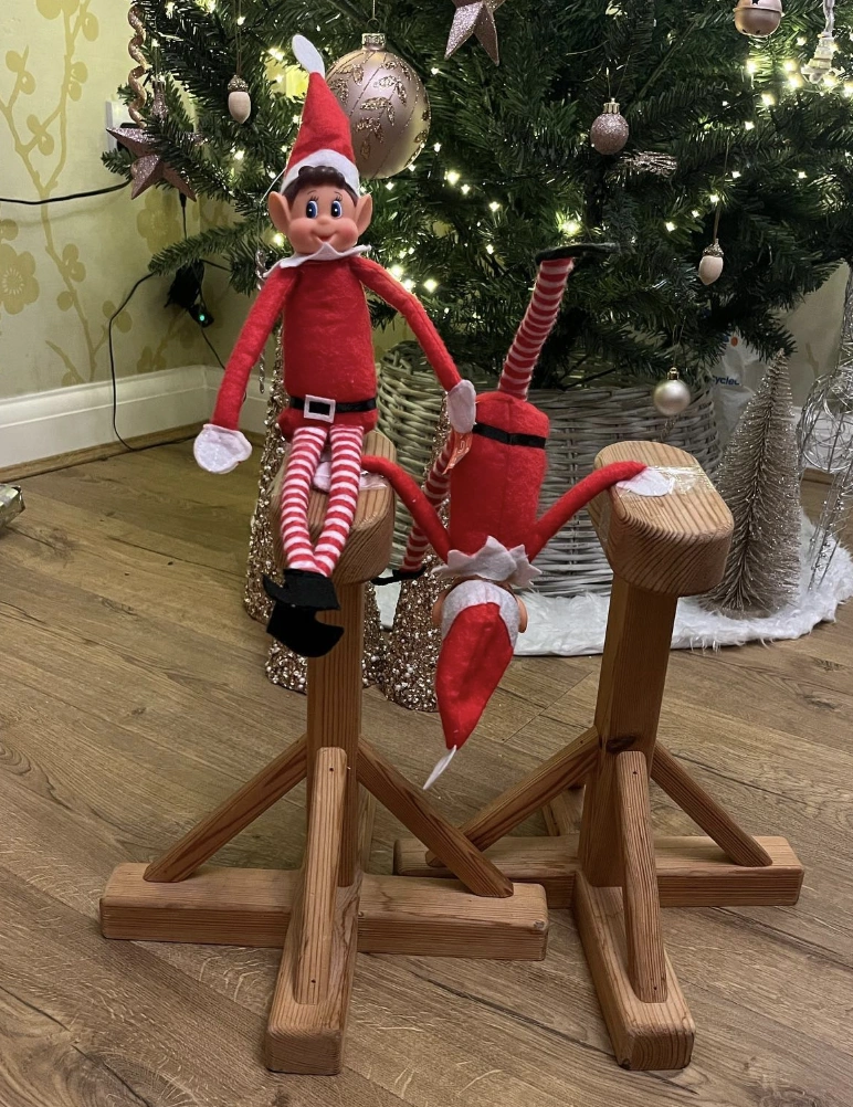 Charming Red Elf on the Shelf with Playful Pose