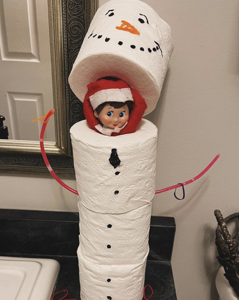 Charming White Snowman with Playful Elf