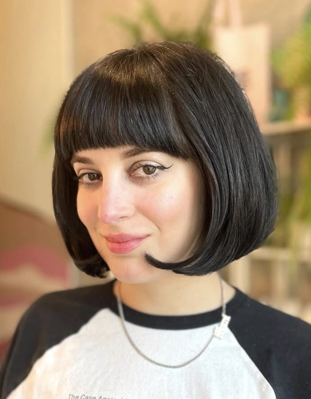 Chic Rounded Bob with Blunt Bangs in Glossy Black