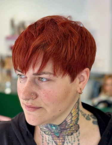 Choppy Pixie Cut with Auburn Hue and Full Fringe