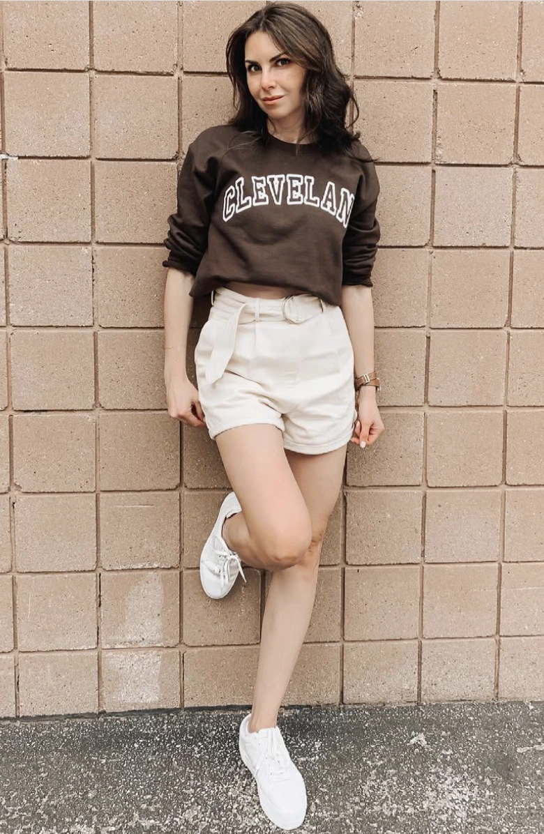 Collegiate Sweatshirt + High-Waisted Shorts + White Sneakers