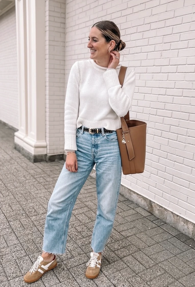 Cream Knit Sweater + Distressed Denim + Leather Sneakers + Bucket Bag