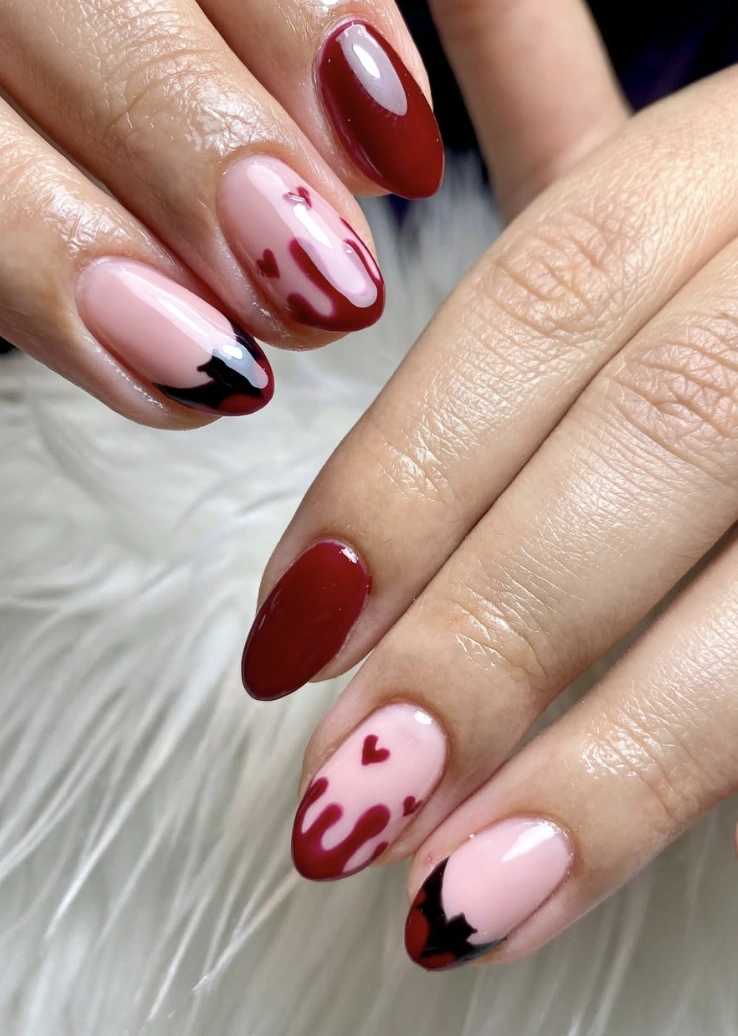 Crimson Drip Almond Nails with Bat Accent