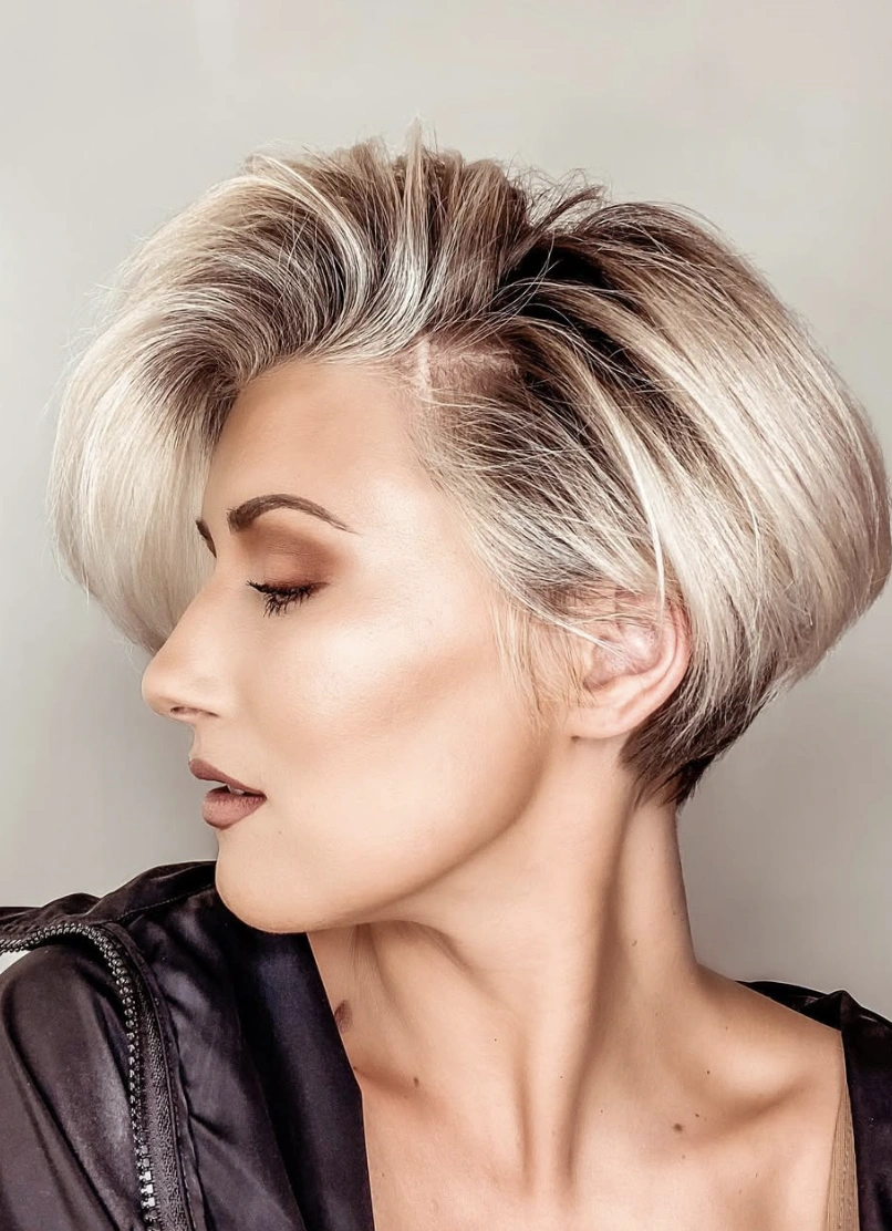 Dimensional Blonde Layered Asymmetrical Pixie with Dark Roots