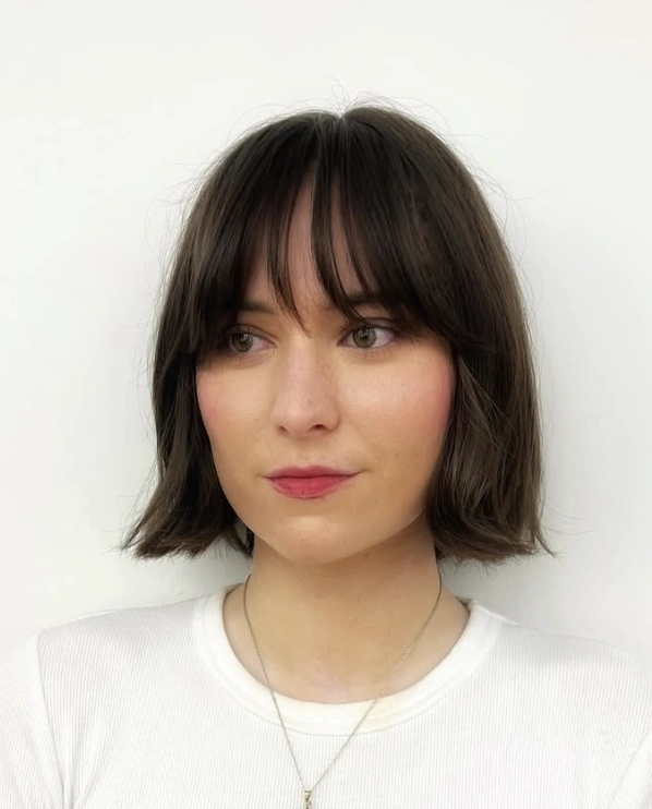 Effortless Chic: Blunt Bob with Brow-Skimming Bangs
