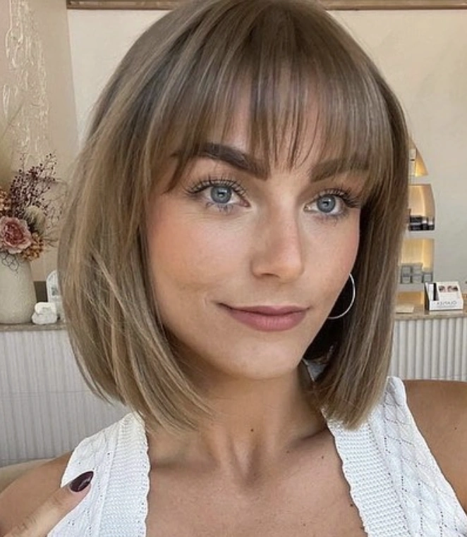 Effortless Chic: Blunt Medium Bob with Wispy Bangs