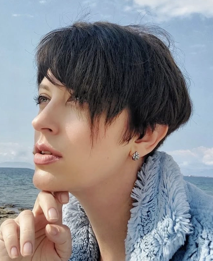 Effortless Chic: Dark Chocolate Textured Longer Pixie Haircut with Wispy Bangs