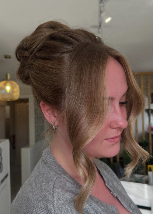Elegant Twisted Updo with Face-Framing Waves