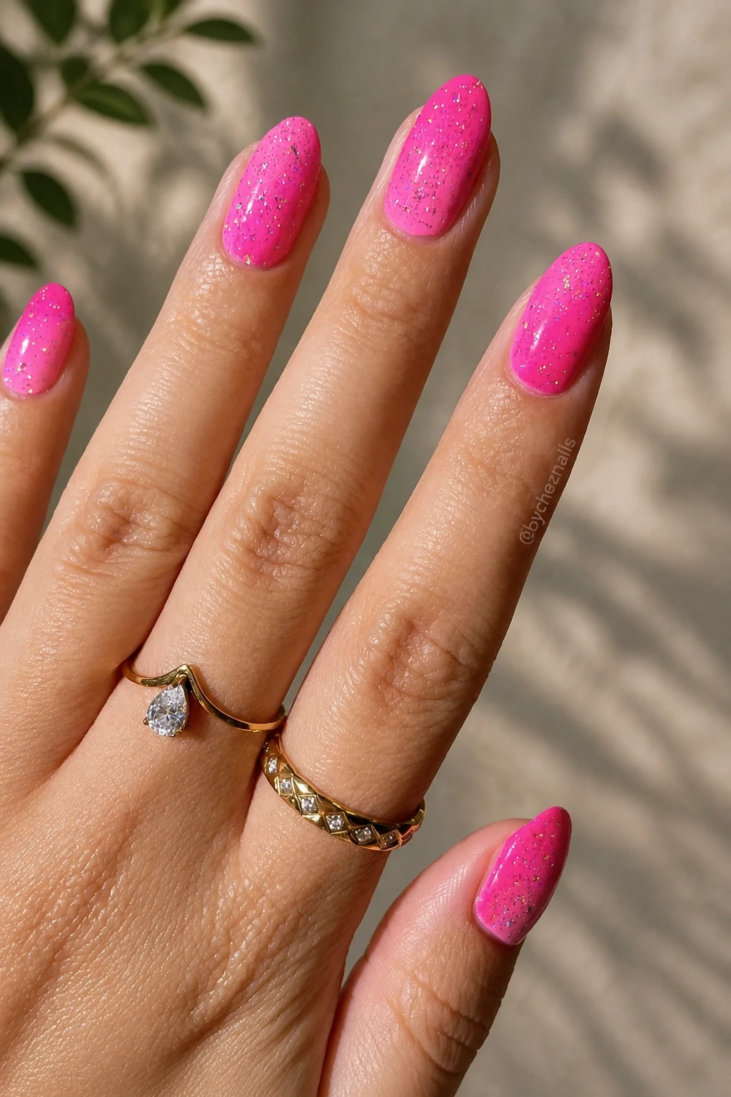 12- Glossy Hot Pink Glitter Almond Nails