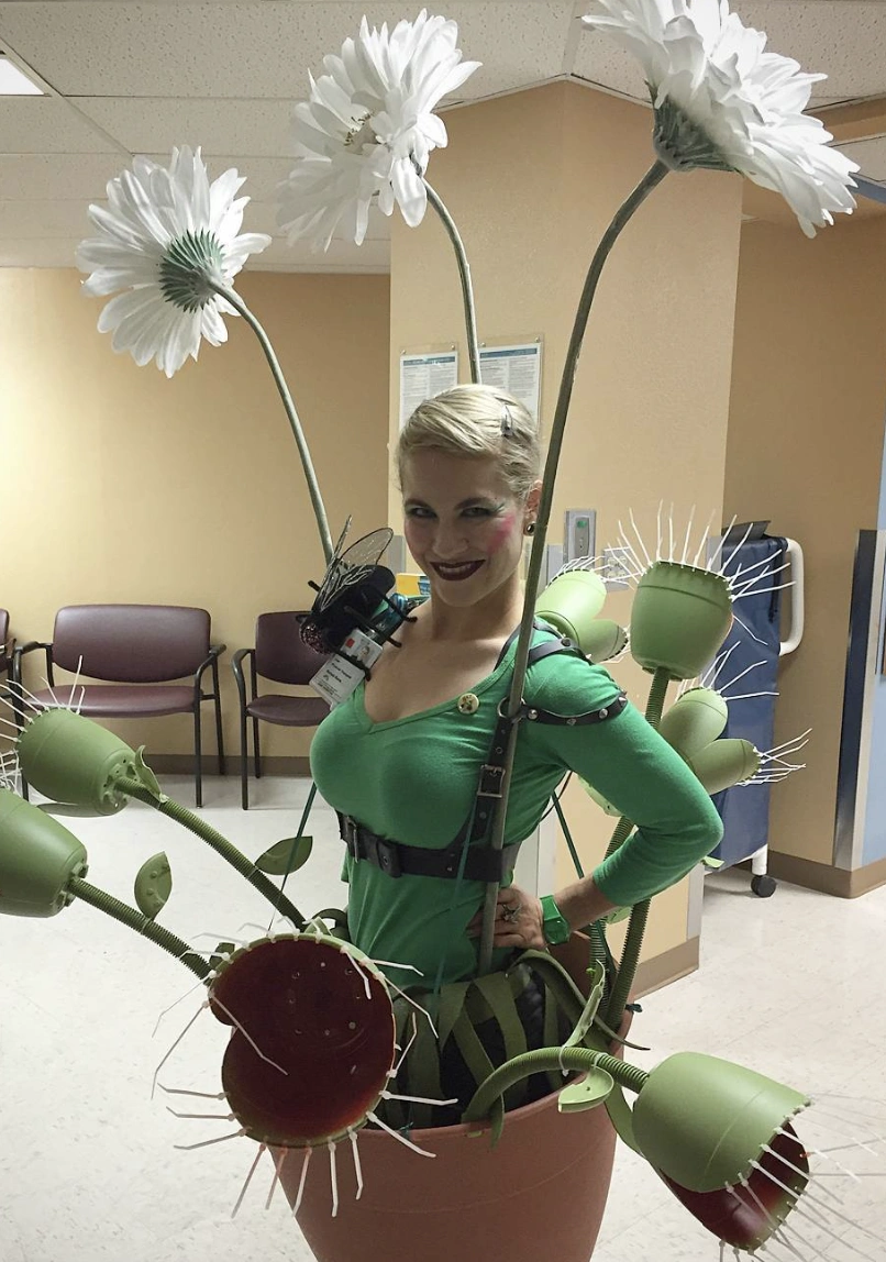 Green Long-Sleeve Top + Flower Costume Accessories + Black Harness Belt + Floral Makeup