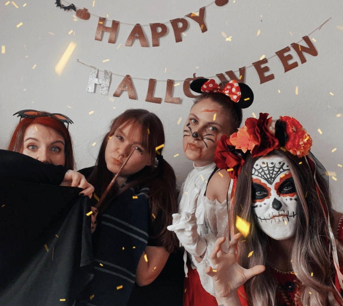 Halloween Group Costumes + Fun Cat Makeup + Colorful Floral Headband + Classic Witch Cape + Playful Minnie Mouse Ears