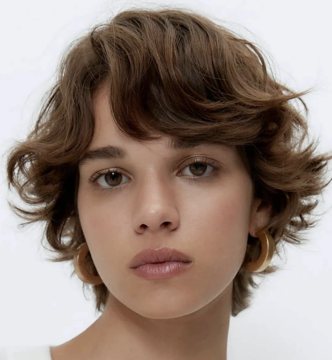Layered and Wavy Brown Long Pixie Bob Hairstyle