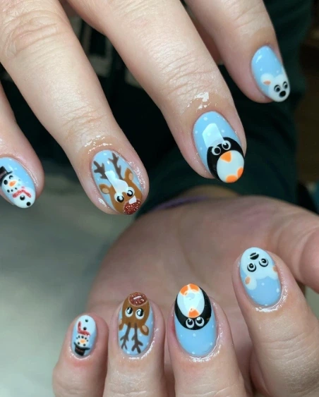 13- Light Blue Almond Nails With Christmas Characters