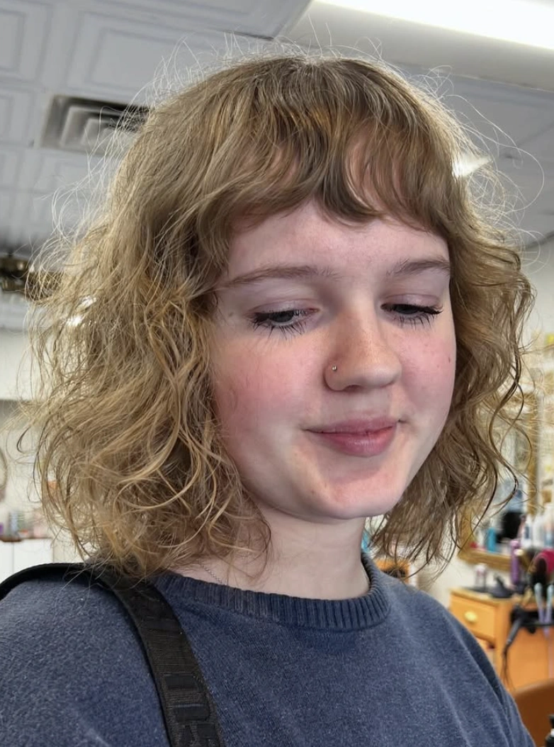 Messy, Layered Blonde Bob Haircut with Bangs
