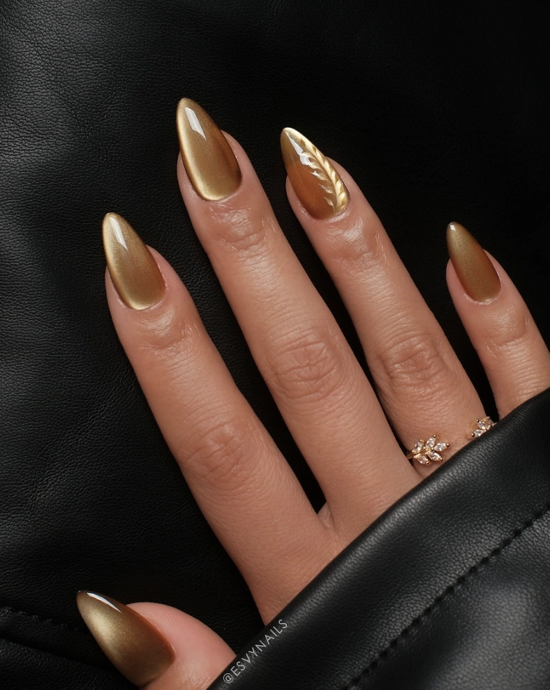 Metallic Gold Cateye Almond Nails with Gold Leaf Accent