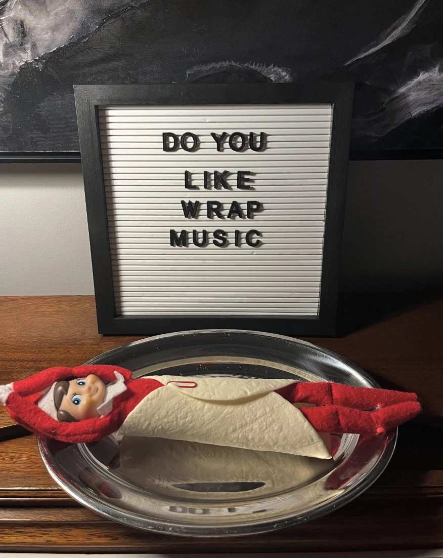Mischievous Red Elf on the Shelf Wrapped in a Tortilla