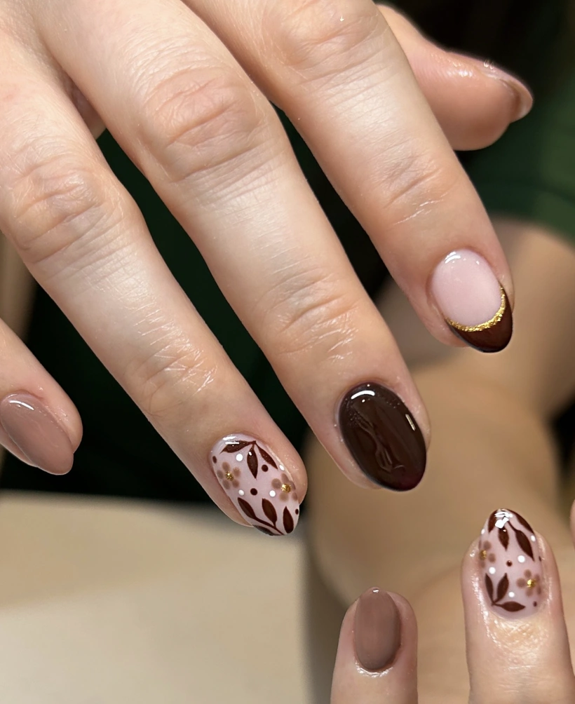 Mixed Tone Nails: Nude, Floral Accent, and Dark Brown Tips