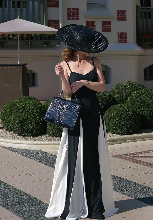 Monochrome Glam: Black White Gown with Wide-Brim Hat