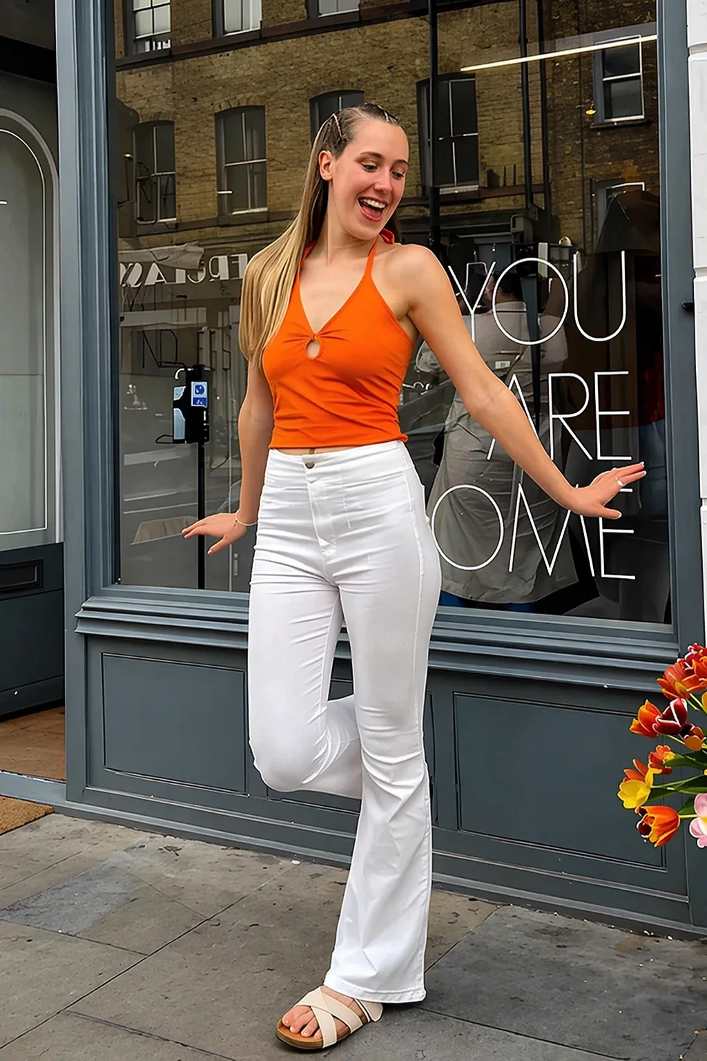 Orange Halter Top + White Flared Jeans + Beige Slide Sandals