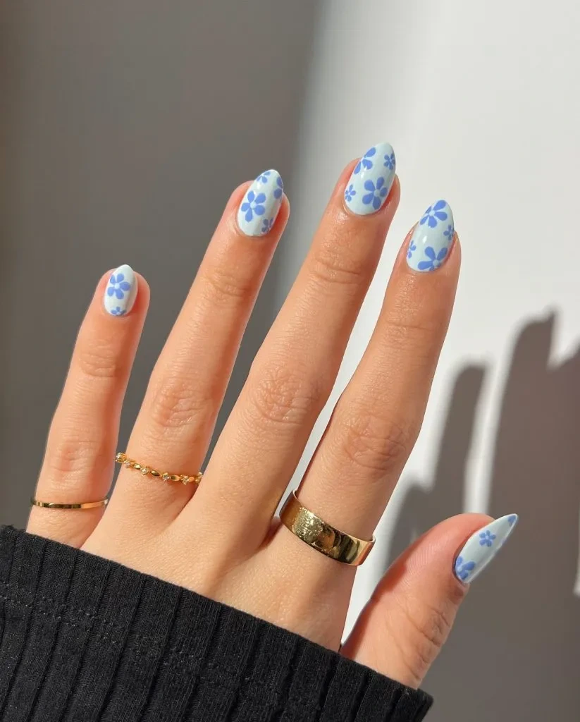 5- Oval Nails With Blooming Blue Petals