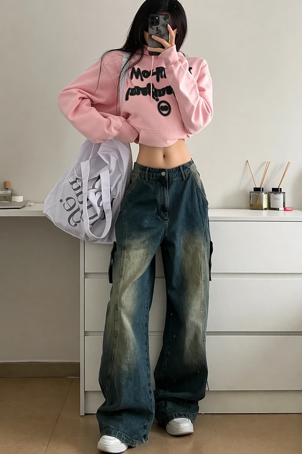 Pink Cropped Graphic Hoodie + Blue Baggy Cargo Jeans + White Sneakers