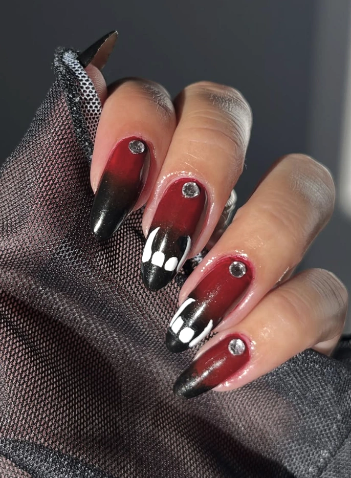 Red and Black Ombre Stiletto Nails with Gem Accents