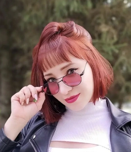 Rounded Bob with Micro Bangs in a Vibrant Red Hair Style