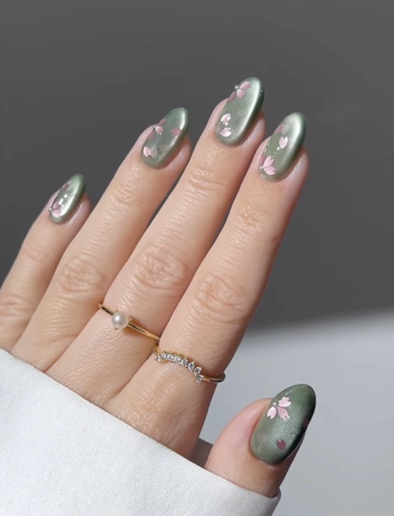 Shimmering Spring Green Nails with Cherry Blossom Accents