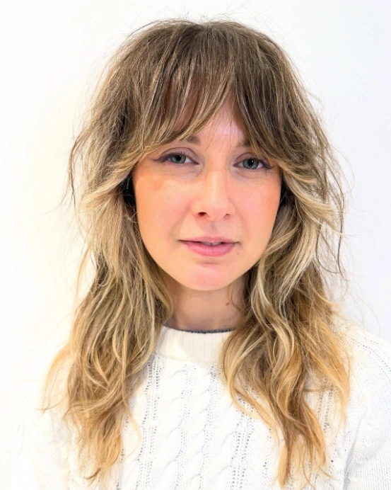 Shoulder-Length Shag with Bangs: Blonde Highlights for Thick Hair
