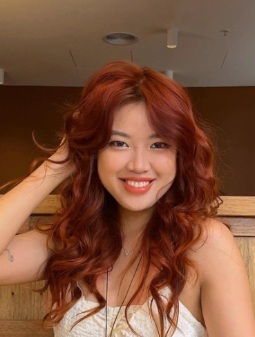 Shoulder Length Wavy Hairstyle in Auburn Red