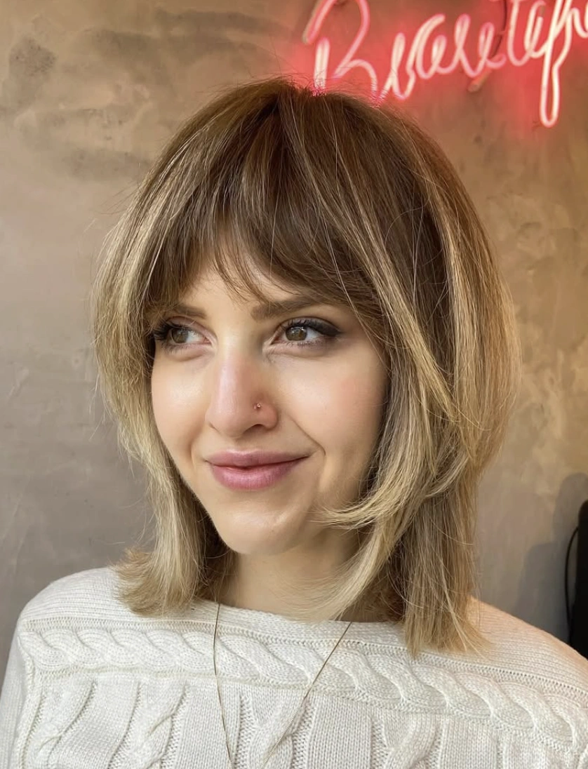 Softly Layered Blonde Bob with Wispy Bangs