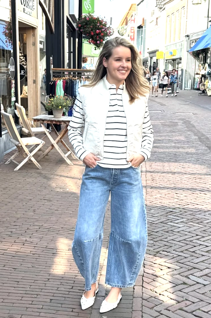 Striped Long-Sleeve + Quilted Vest + Barrel Jeans + White Pointed Flats