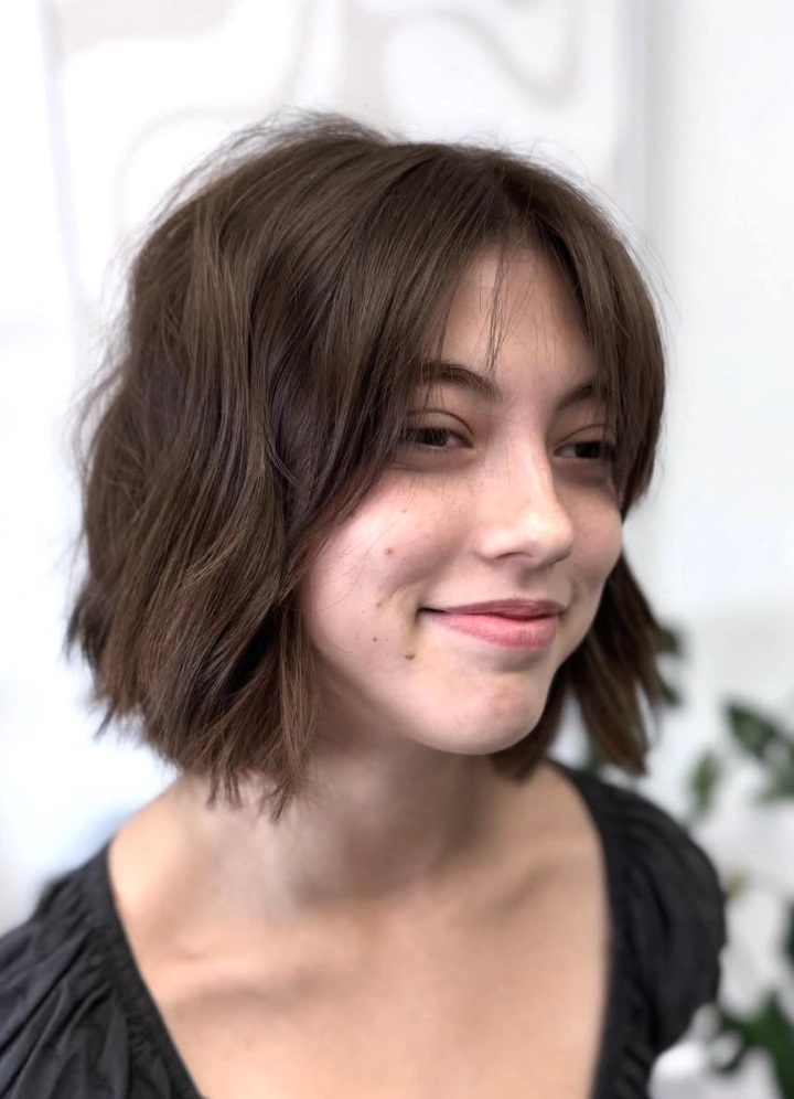 Wavy Chocolate Brown Shoulder Bob Haircut with Face-Framing Bangs