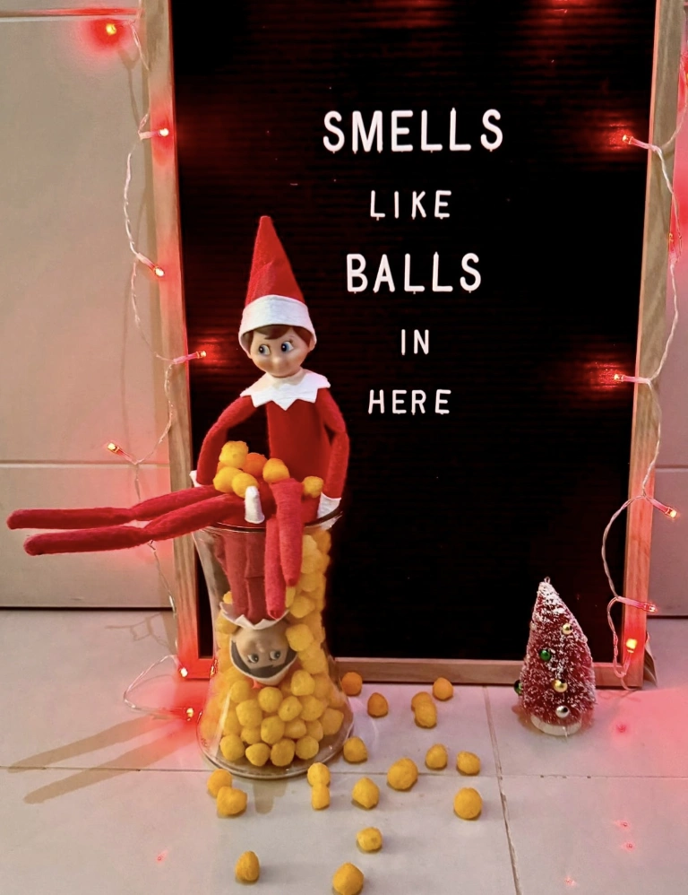 Whimsical Red and White Elf with Playful Puffs