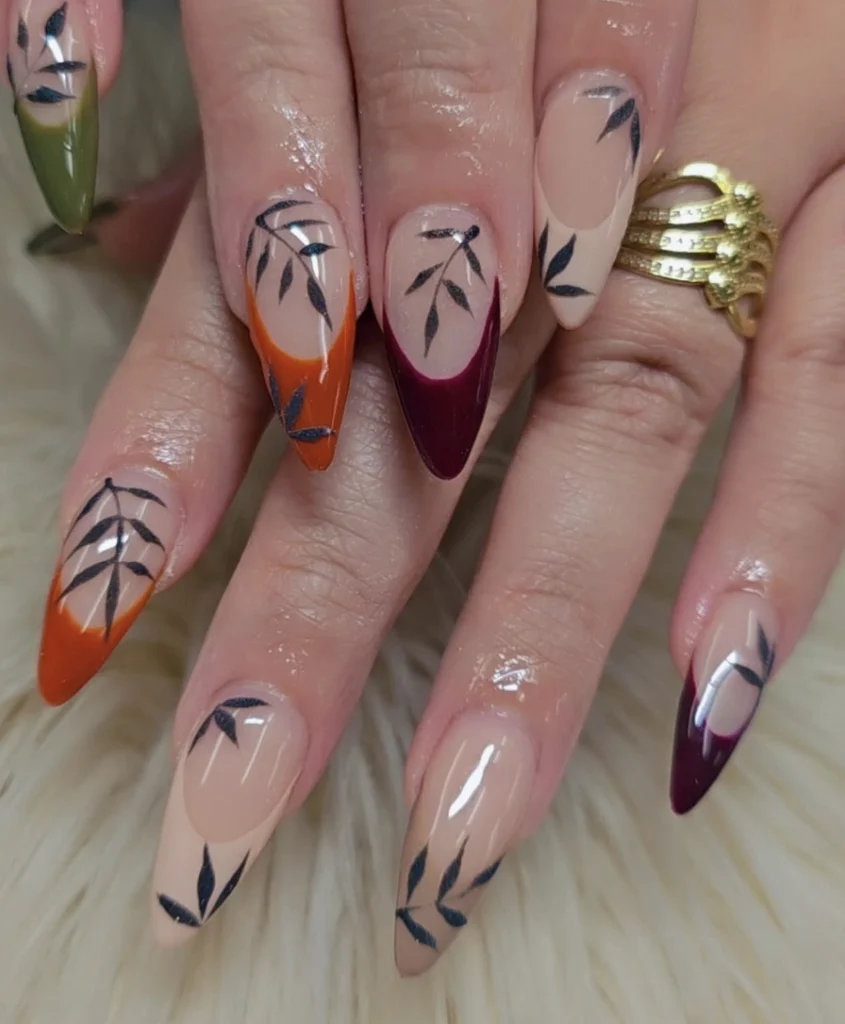 Almond Fall Nails Design Featuring Earthy Tones and Leafy Detailing