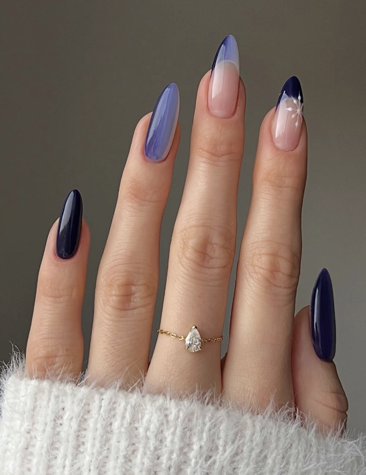 Almond Nails with Blue Gradient, Reverse French, and Snowflake Detail