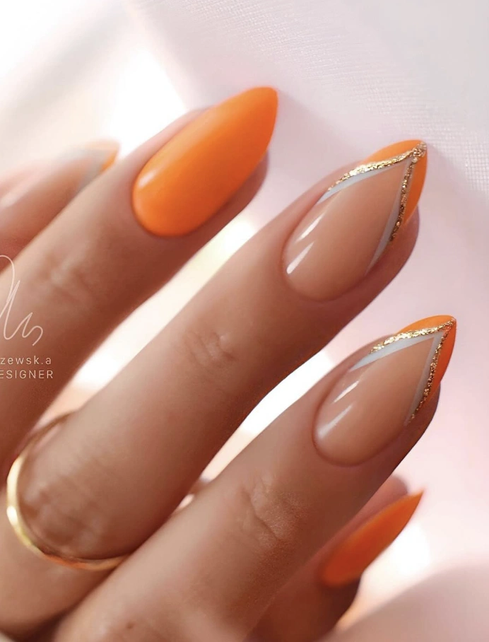 Almond Nails with Bold Orange Tips and Geometric Gold Detail